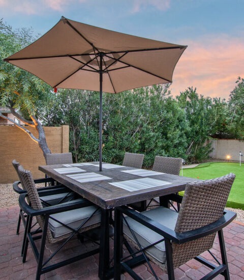 Dining area located next to putting green to keep everyone together even if you don't play.