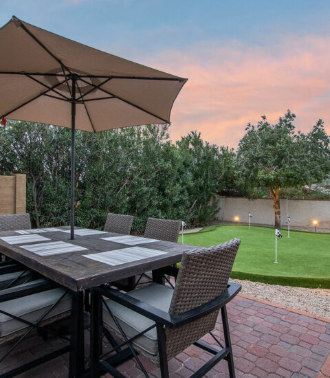 Dining area located next to putting green to keep everyone together even if you don't play.