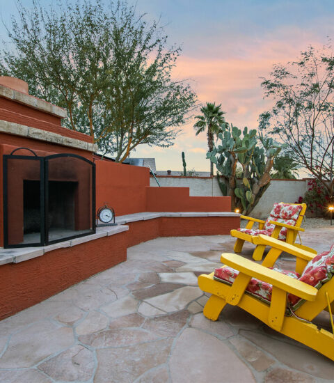 Outdoor wood burning fireplace and smoking area.