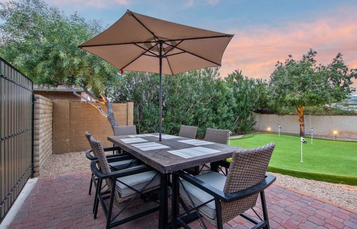 Dining area located next to putting green to keep everyone together even if you don't play.