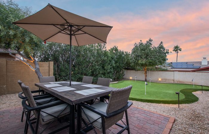 Dining area located next to putting green to keep everyone together even if you don't play.